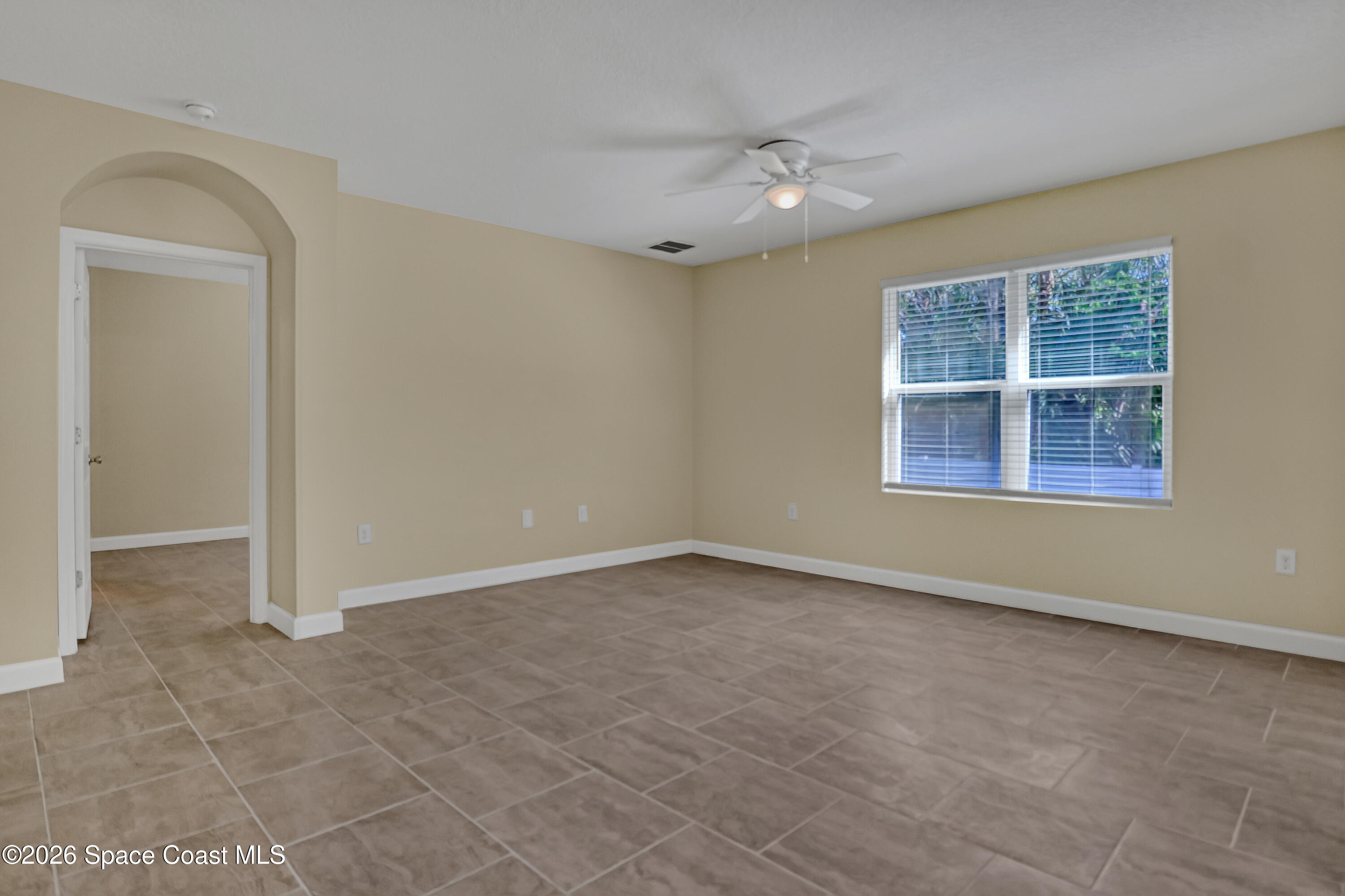 2605 Falcon Lane Mims, FL 32754 - Photo 12 of 29 a view of an empty room with a window