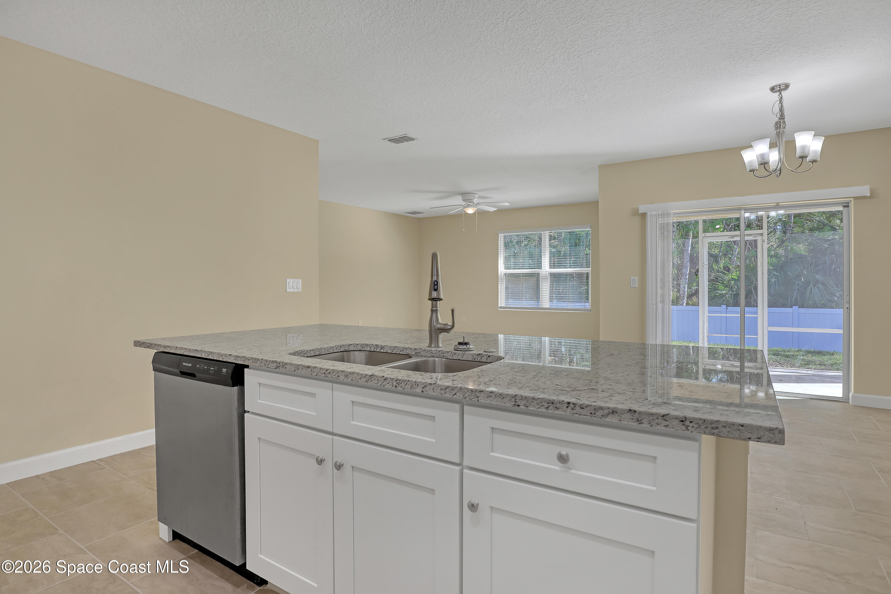 2605 Falcon Lane Mims, FL 32754 - Photo 13 of 29 a bathroom with a granite countertop sink and a mirror