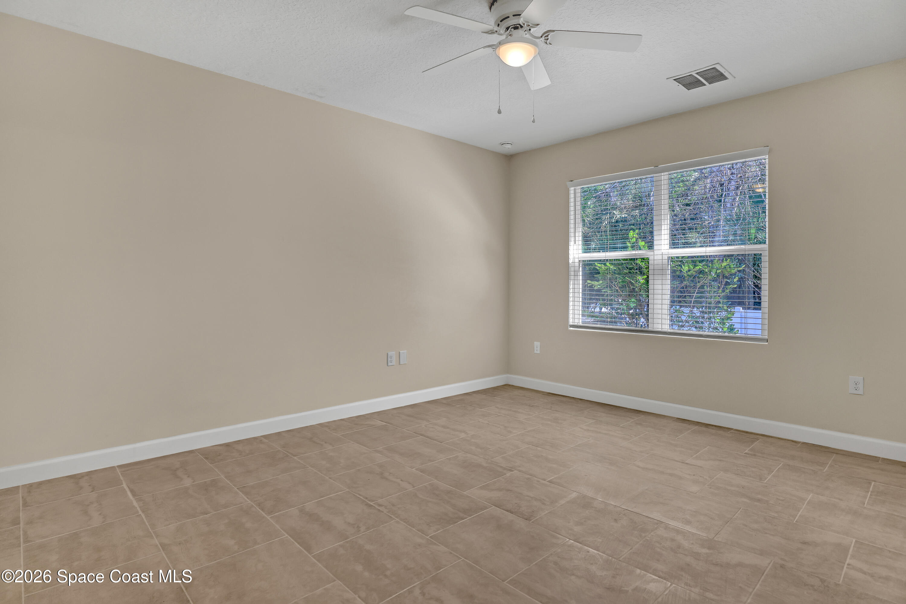 2605 Falcon Lane Mims, FL 32754 - Photo 14 of 29 an empty room with a window