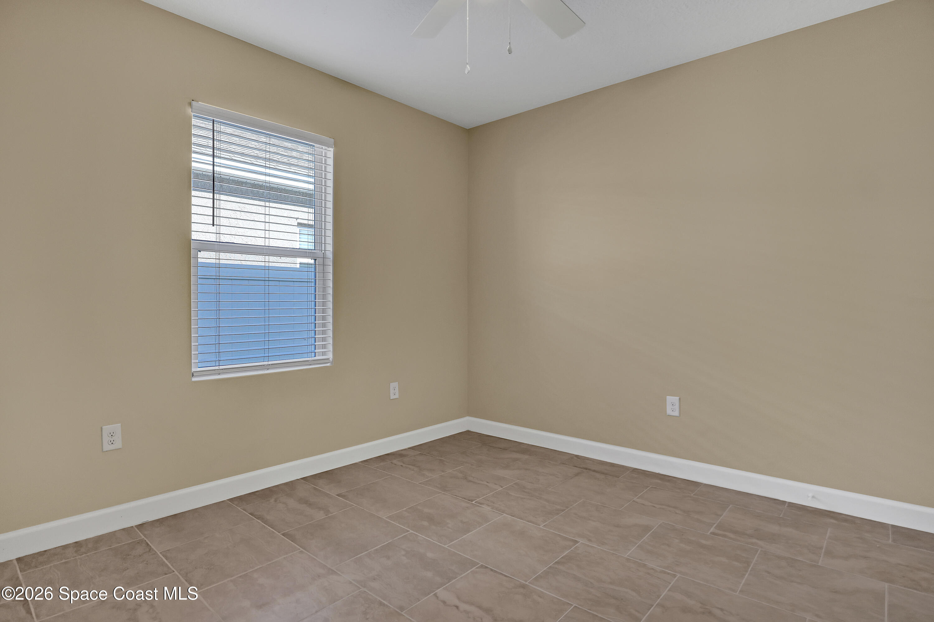 2605 Falcon Lane Mims, FL 32754 - Photo 19 of 29 an empty room with a window