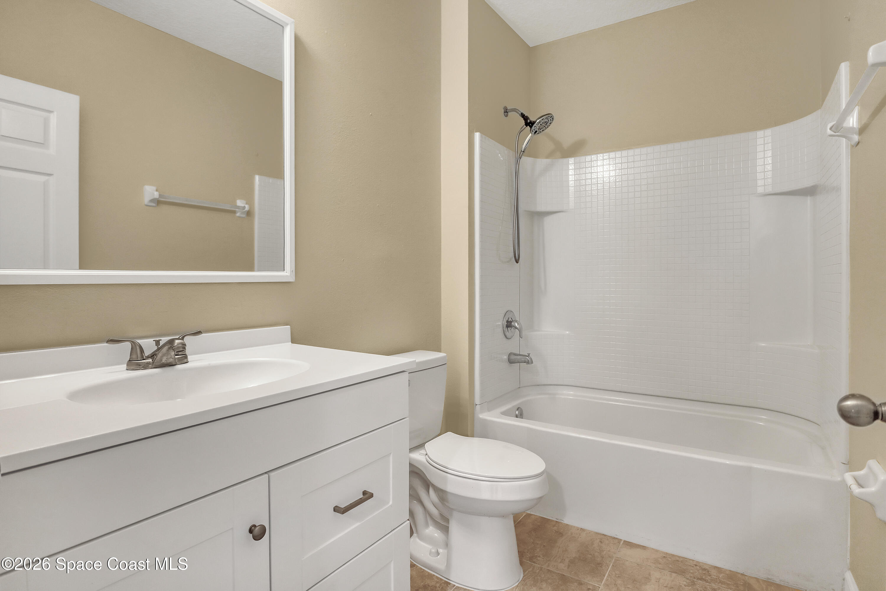 2605 Falcon Lane Mims, FL 32754 - Photo 21 of 29 a bathroom with a sink a toilet and shower