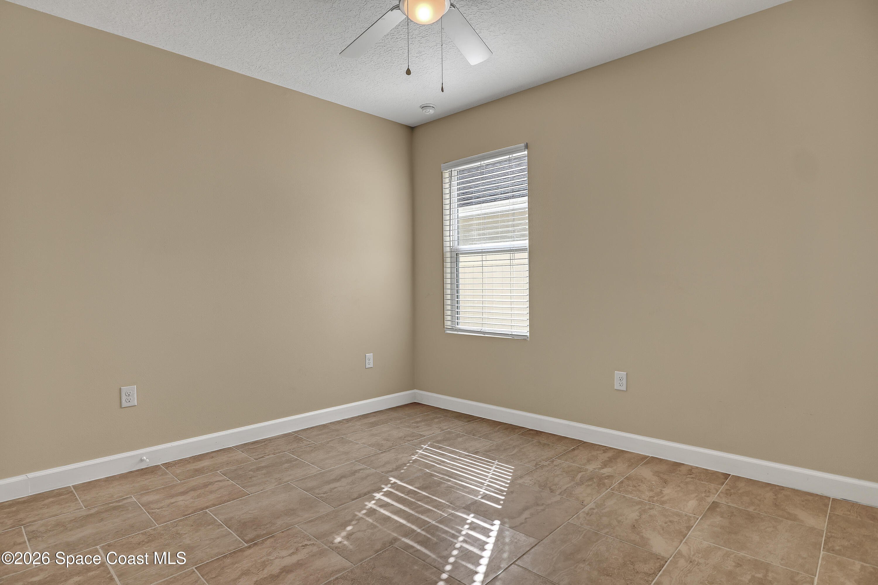 2605 Falcon Lane Mims, FL 32754 - Photo 22 of 29 a view of an empty room with a window
