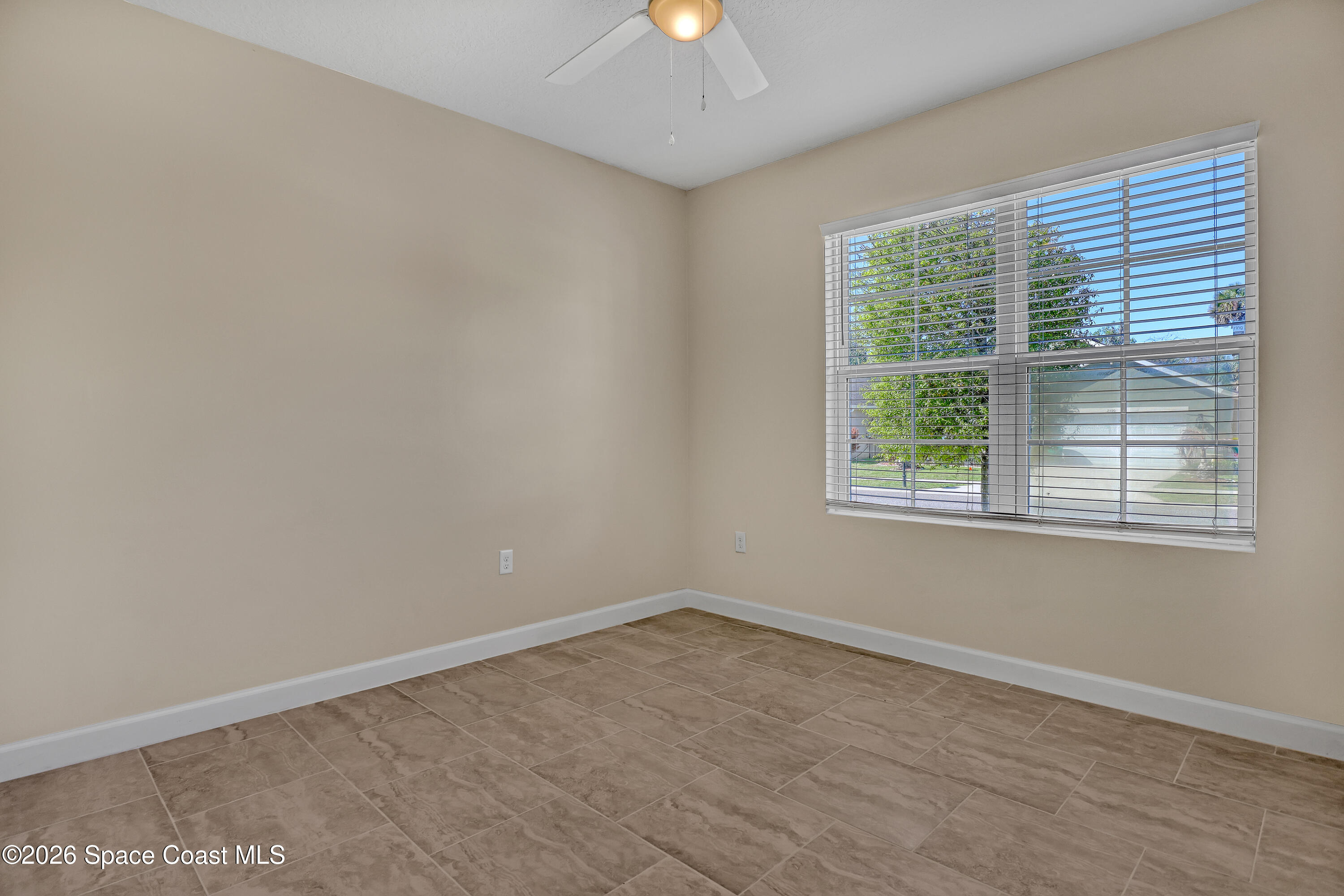 2605 Falcon Lane Mims, FL 32754 - Photo 24 of 29 an empty room with a window