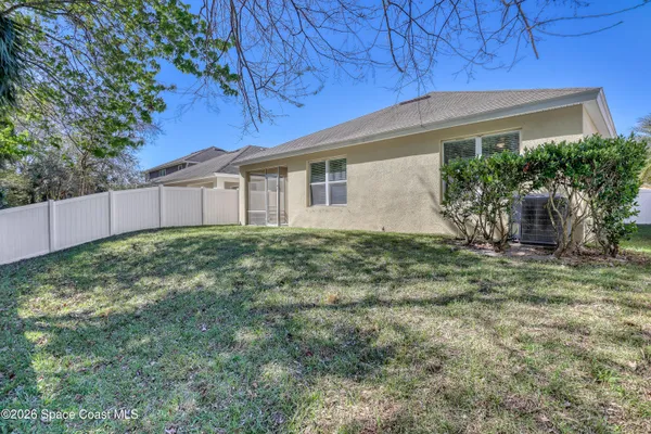 a big yard with large trees