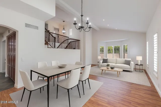 a kitchen with stainless steel appliances granite countertop wooden cabinets a stove a sink and a granite counter top