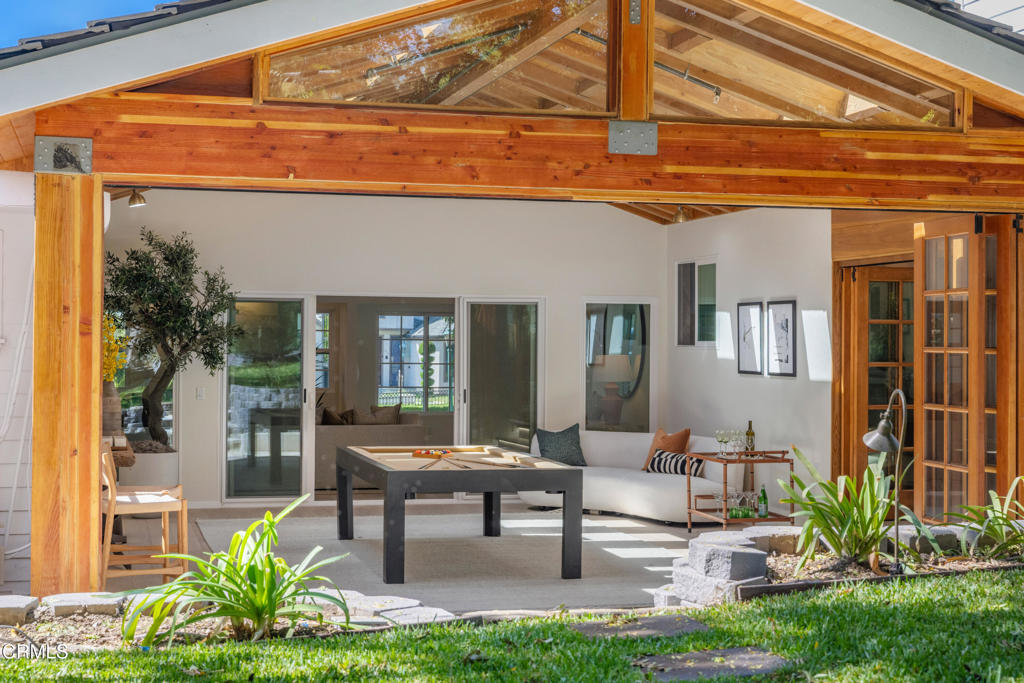 875 San Simeon Road Arcadia, CA 91007 - Photo 17 of 60 a view of a patio with table and chairs potted plants and floor to ceiling window and potted plants