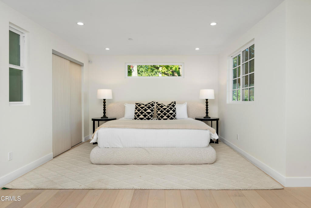 875 San Simeon Road Arcadia, CA 91007 - Photo 18 of 60 a spacious bedroom with a bed and a window