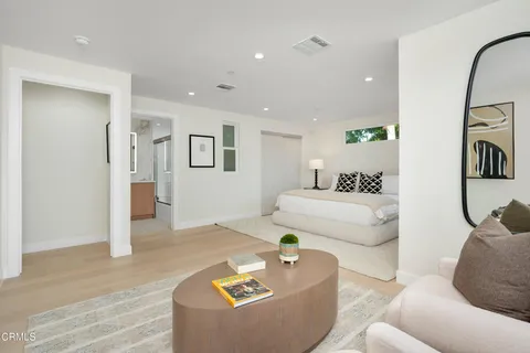 a view of a livingroom with furniture and a potted plant