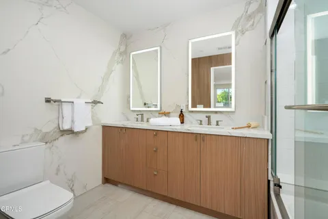 a bedroom with a large bed and furniture