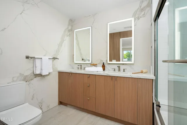 a bedroom with a large bed and furniture