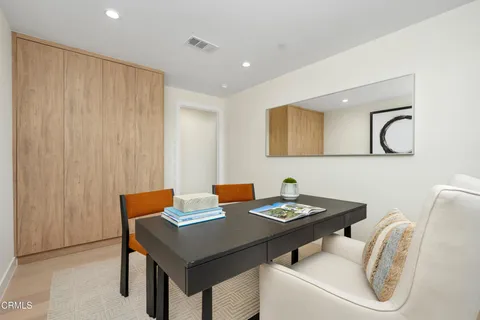 a bathroom with a sink and mirror with toilet