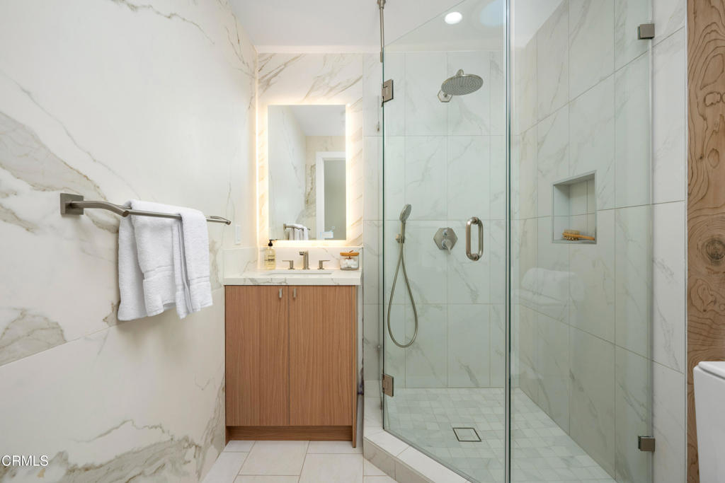 875 San Simeon Road Arcadia, CA 91007 - Photo 27 of 60 a bathroom with a shower sink and mirror