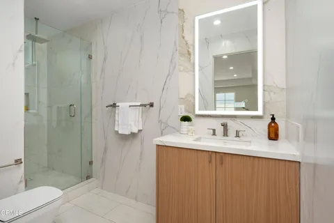 a view of bathroom with a tub and a sink