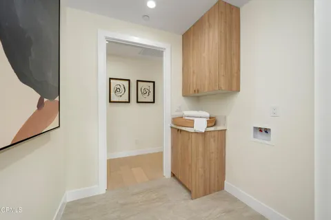 a spacious bathroom with a tub shower and window