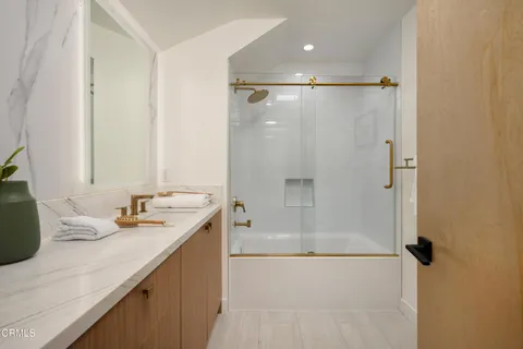 an aerial view of residential house with outdoor space and trees all around