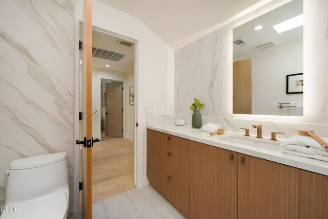 an aerial view of residential house with outdoor space and parking