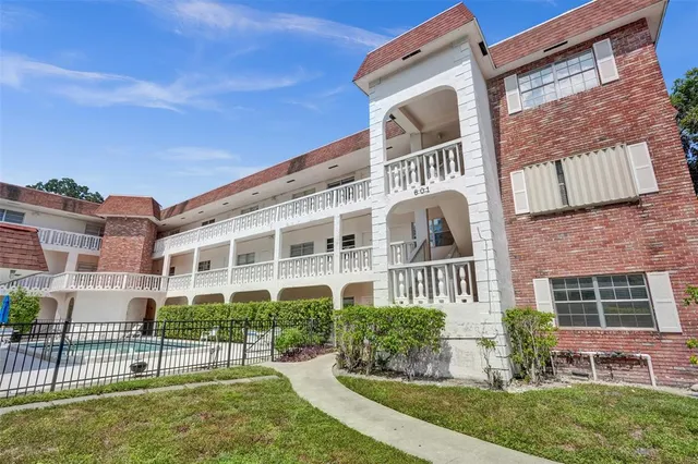 a view of a building with a yard