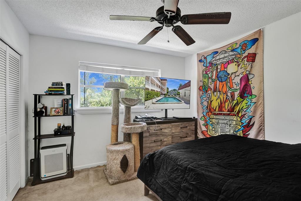 601 Southeast 5th Court, Unit 309 Fort Lauderdale, FL 33301 - Photo 12 of 17 a bedroom with a bed and a window