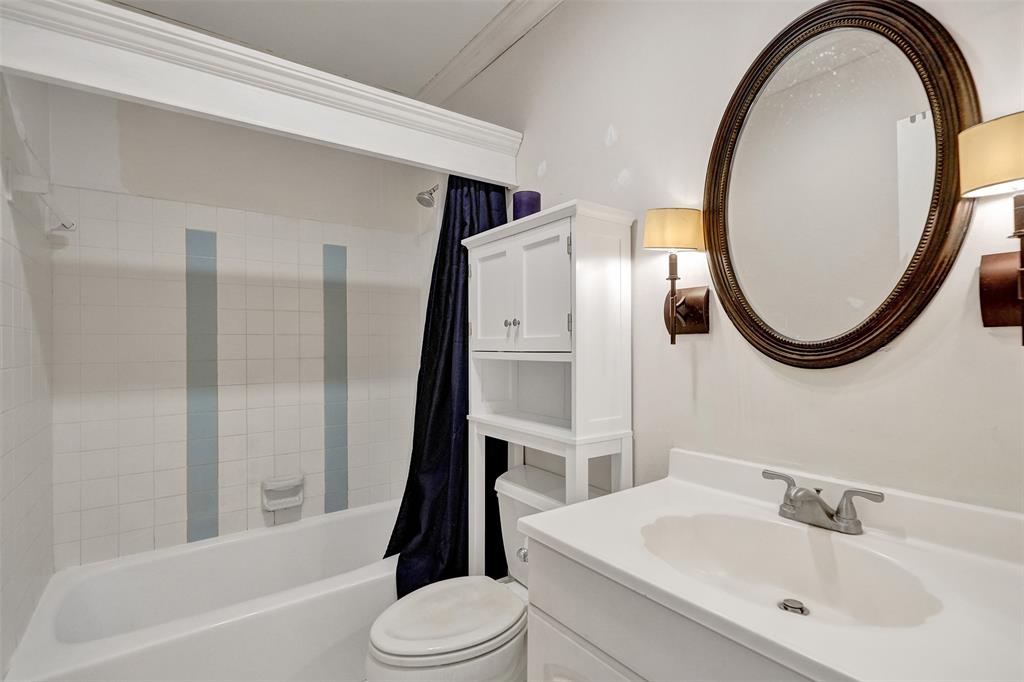 601 Southeast 5th Court, Unit 309 Fort Lauderdale, FL 33301 - Photo 13 of 17 a bathroom with a sink a toilet and a mirror