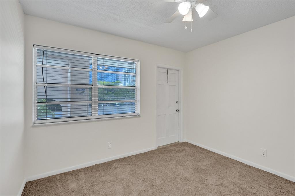 601 Southeast 5th Court, Unit 309 Fort Lauderdale, FL 33301 - Photo 14 of 17 an empty room with a window