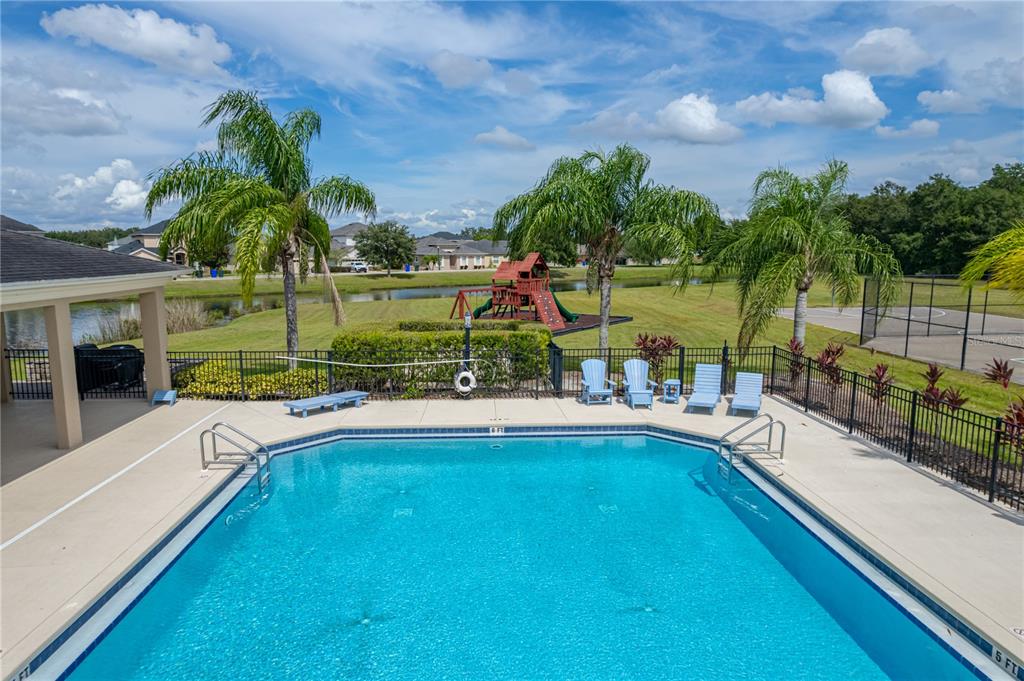 4734 Lathloa Loop Lakeland, FL 33811 - Photo 67 of 87 a view of a house with a swimming pool and sitting area