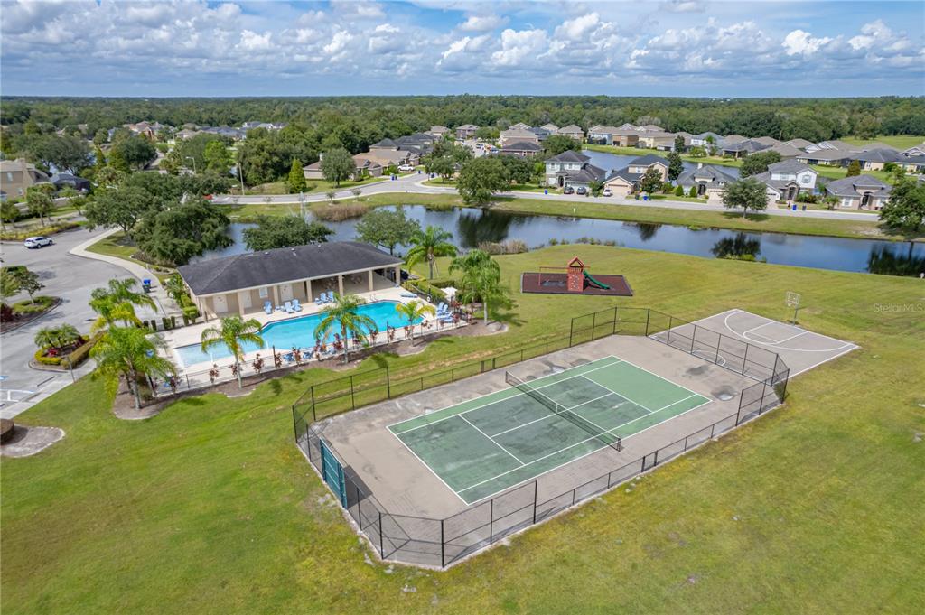 4734 Lathloa Loop Lakeland, FL 33811 - Photo 87 of 87 an aerial view of a house with a garden and lake view