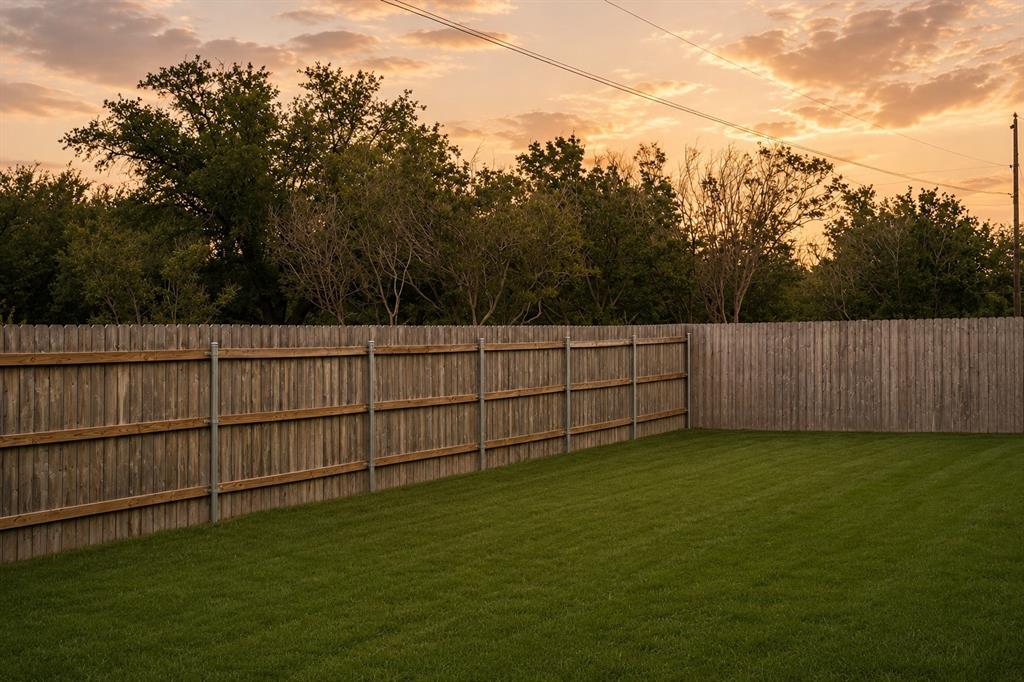 7909 Townsend Drive Waco, TX 76708 - Photo 21 of 22 Expansive backyard featuring a manicured lawn, full privacy fencing, and mature perimeter trees