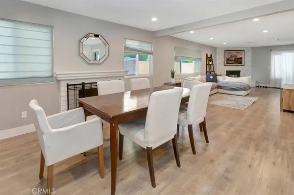 a view of a dining room with furniture and a large window