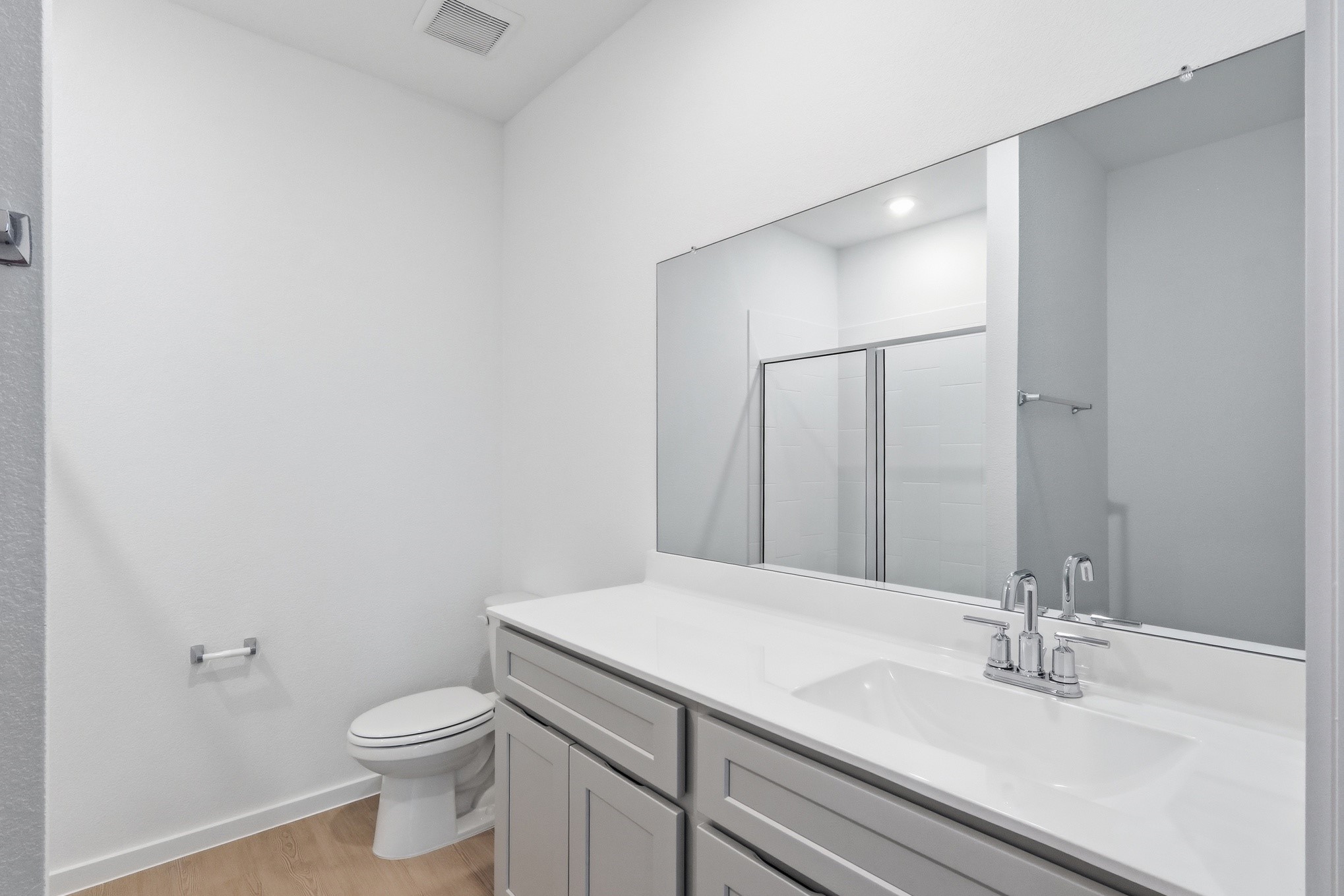 26299 Arrowleaf Drive Magnolia, TX 77355 - Photo 16 of 24 a bathroom with a sink a toilet and vanity