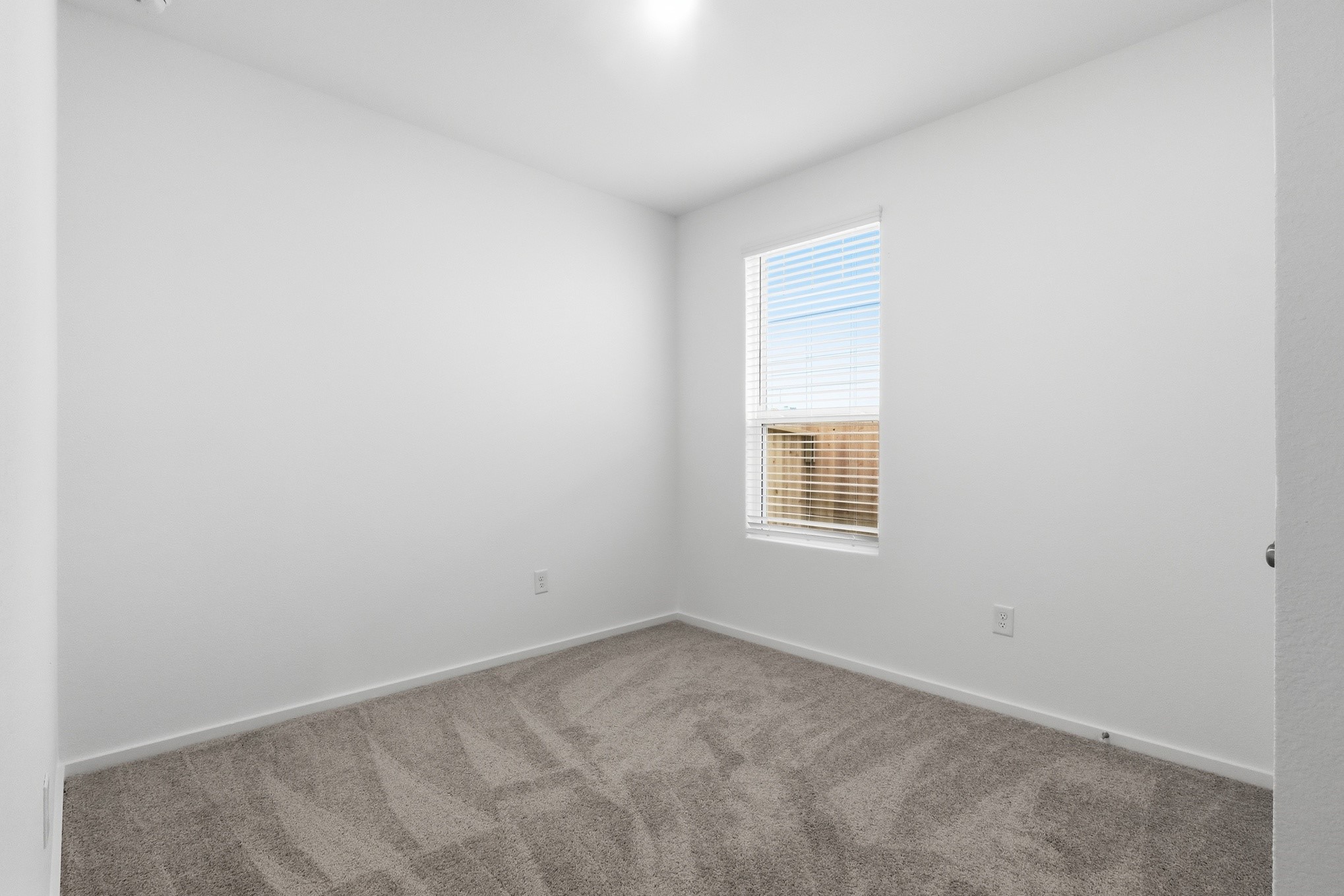 26299 Arrowleaf Drive Magnolia, TX 77355 - Photo 18 of 24 an empty room with a window