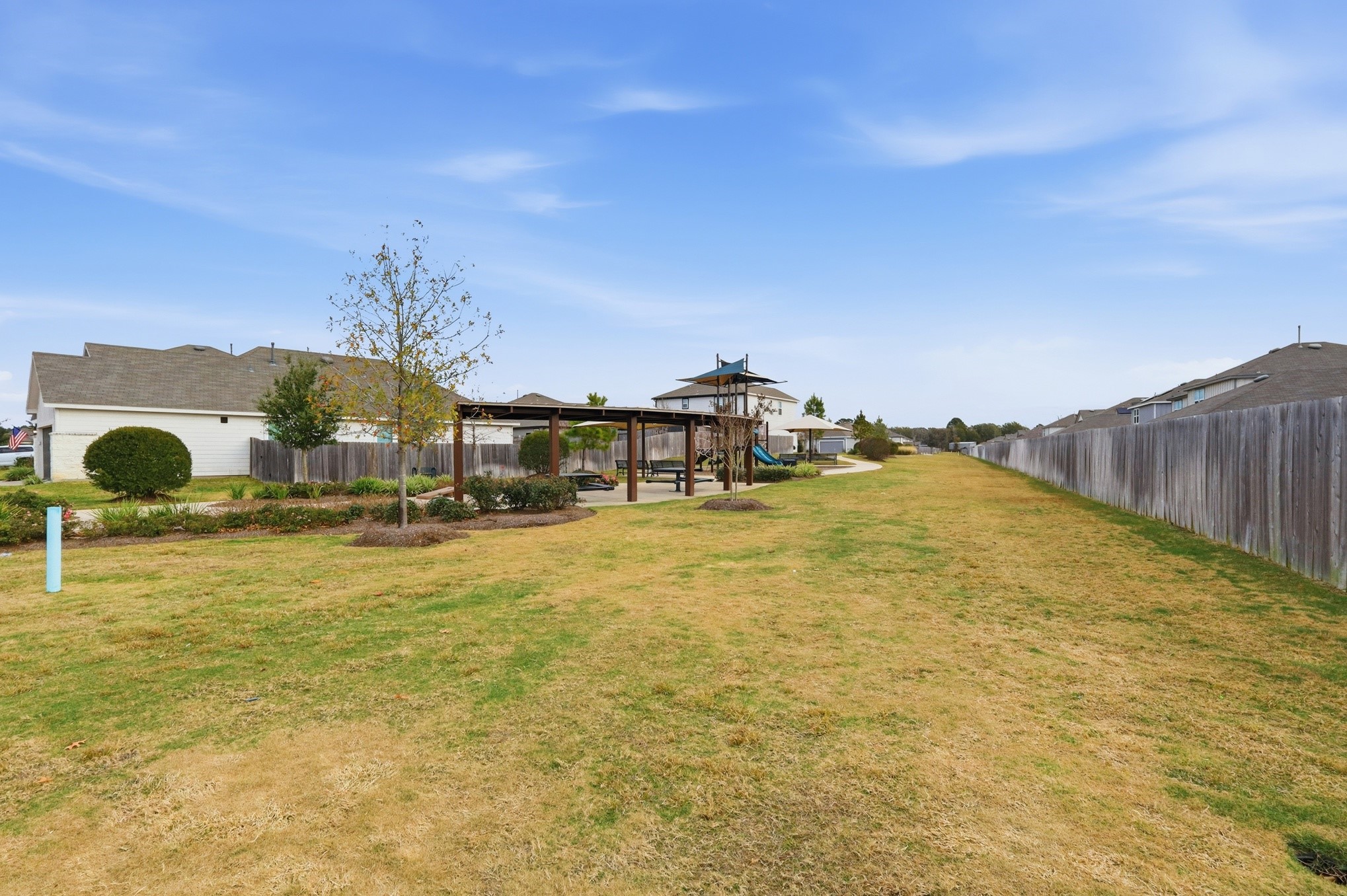 26299 Arrowleaf Drive Magnolia, TX 77355 - Photo 23 of 24 a swimming pool with an outdoor seating