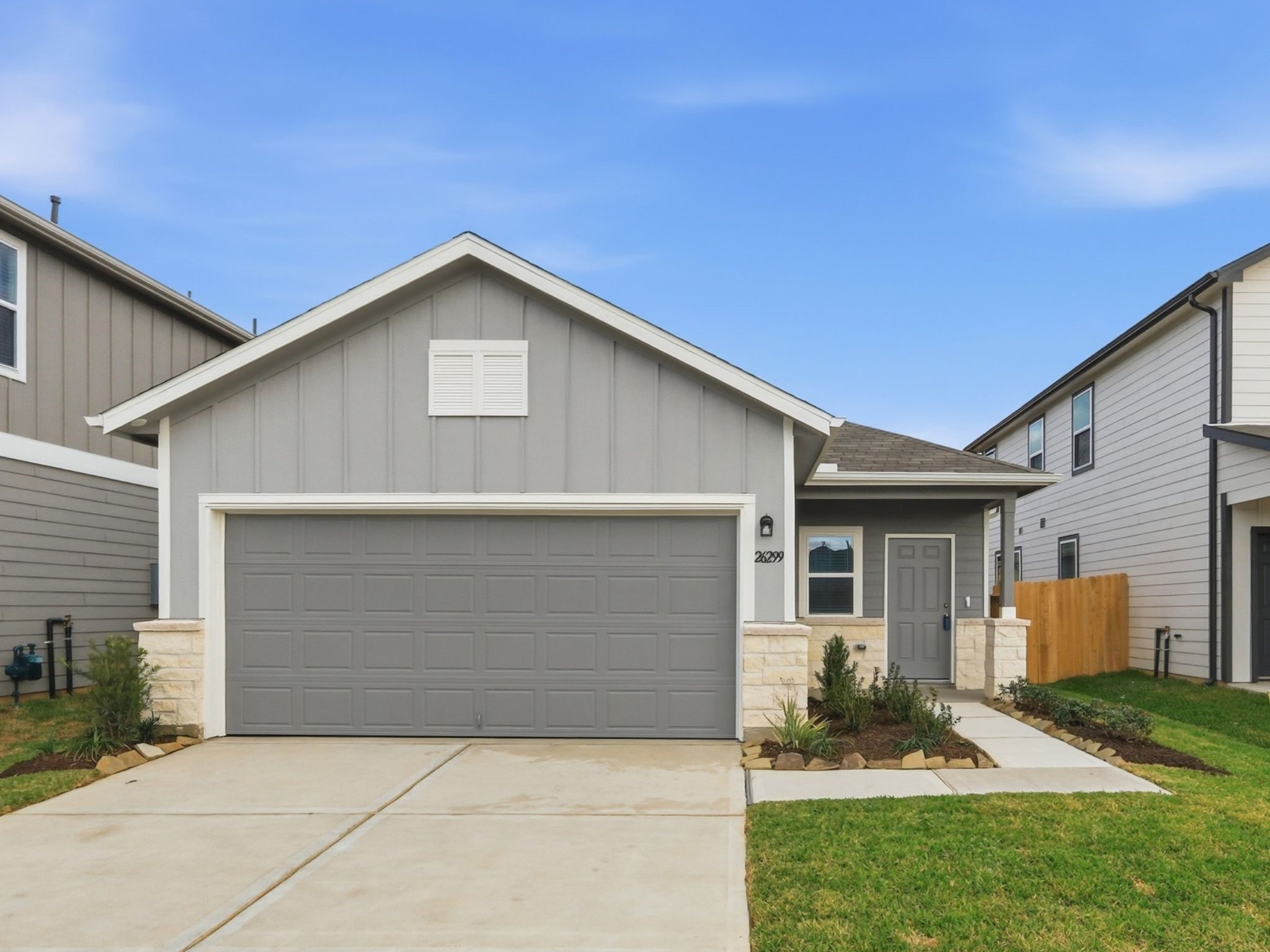 26299 Arrowleaf Drive Magnolia, TX 77355 - Photo 24 of 24 a front view of a house with a yard and garage