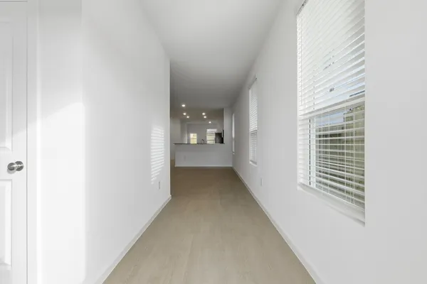 a view of a hallway with windows