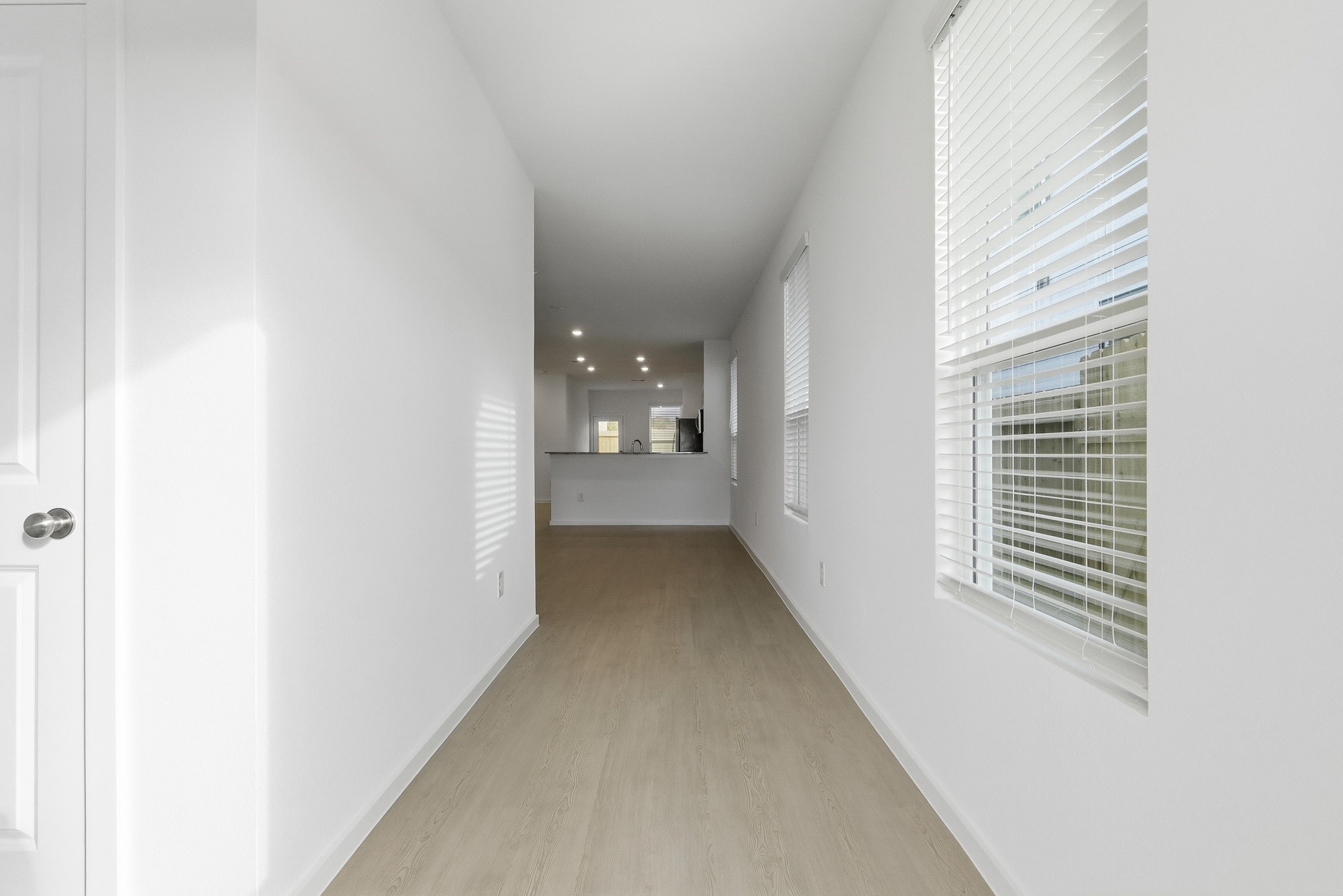 26299 Arrowleaf Drive Magnolia, TX 77355 - Photo 3 of 24 a view of a hallway with windows