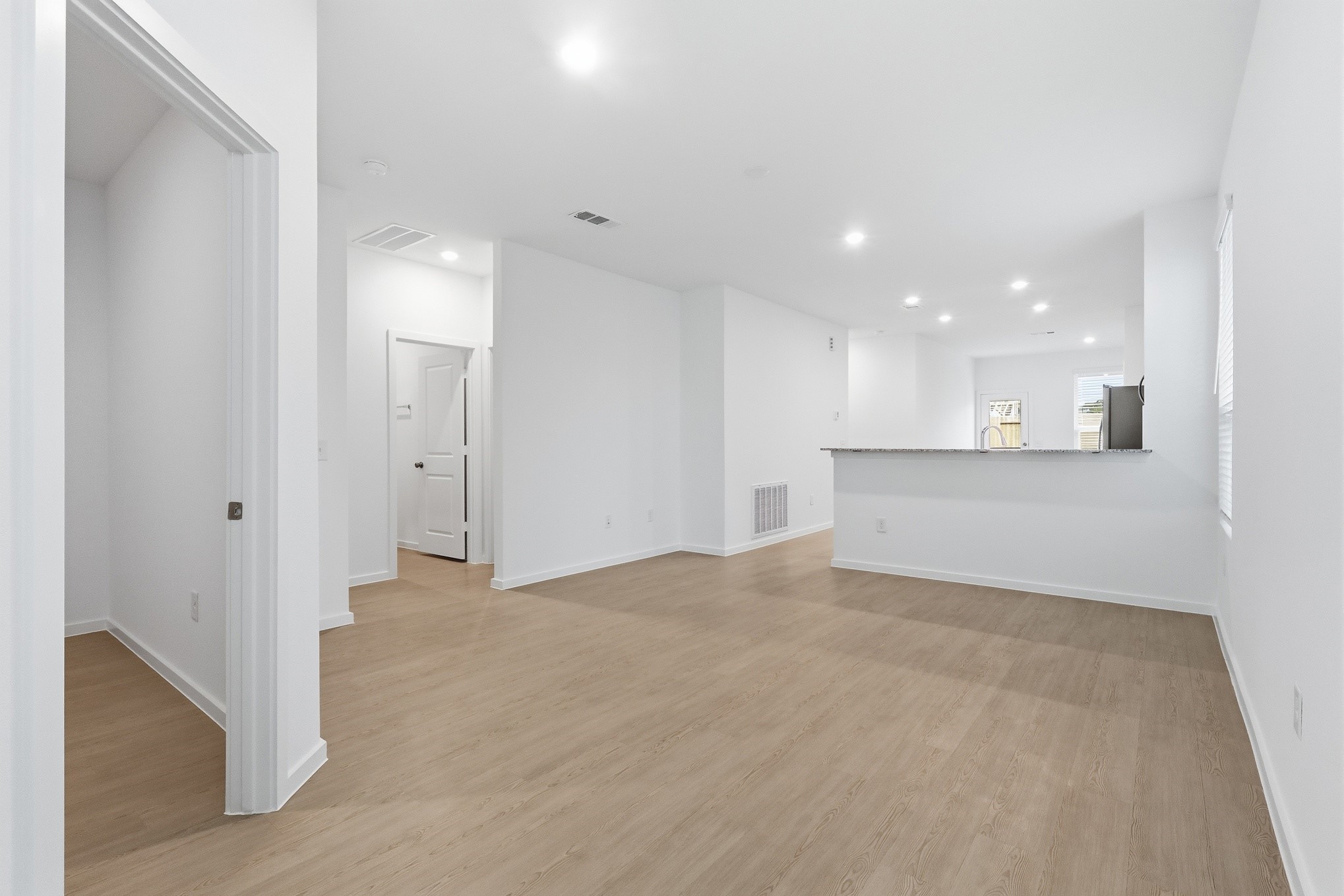 26299 Arrowleaf Drive Magnolia, TX 77355 - Photo 4 of 24 a view of a kitchen with a sink and a refrigerator