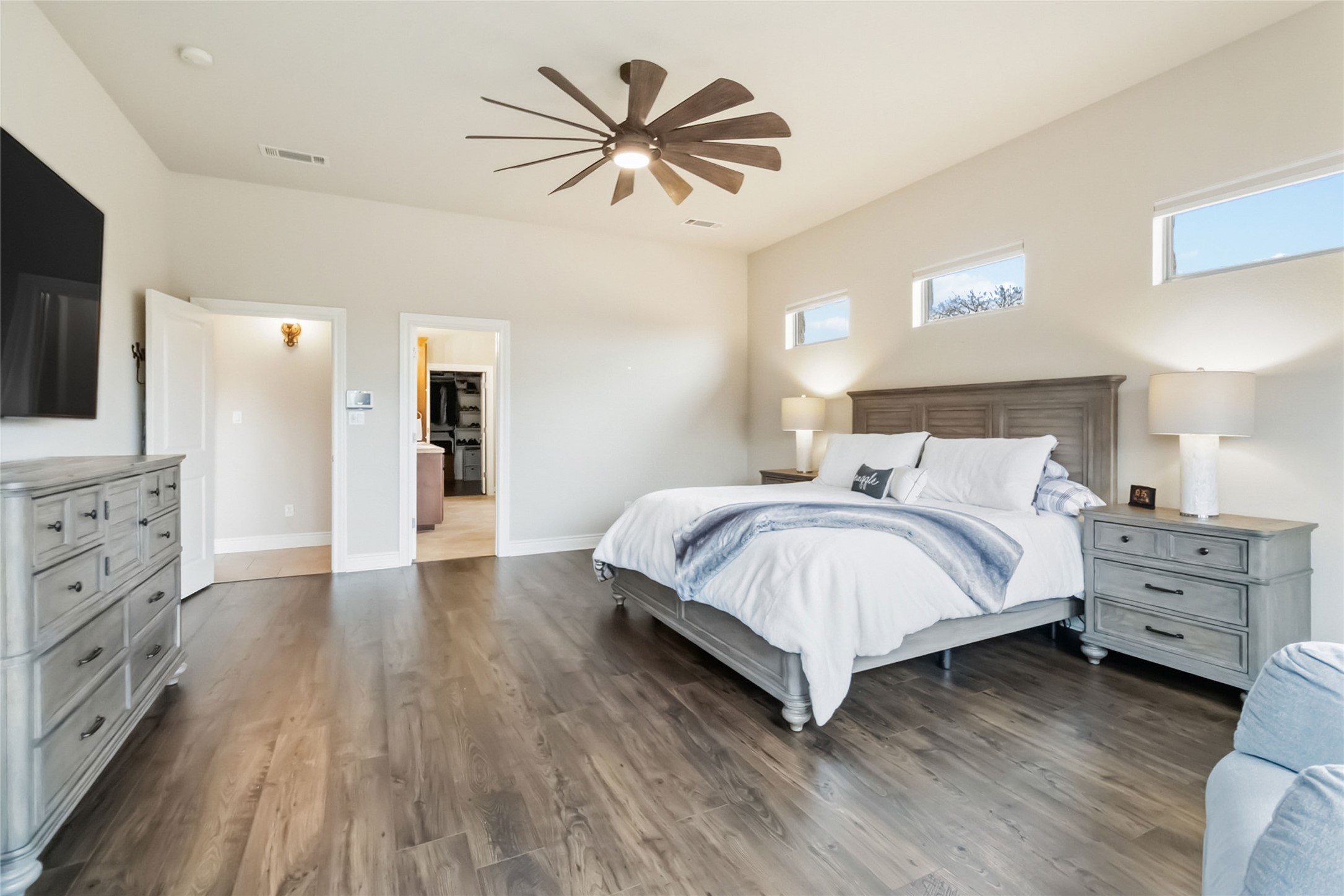 108 Standing Oak Drive Georgetown, TX 78633 - Photo 21 of 37 The oversized primary bedroom easily accommodates large furniture and a sitting area, with a seamless flow into the ensuite bath and walk-in closet. Thoughtful finishes and generous space make this room both comfortable and functional.
