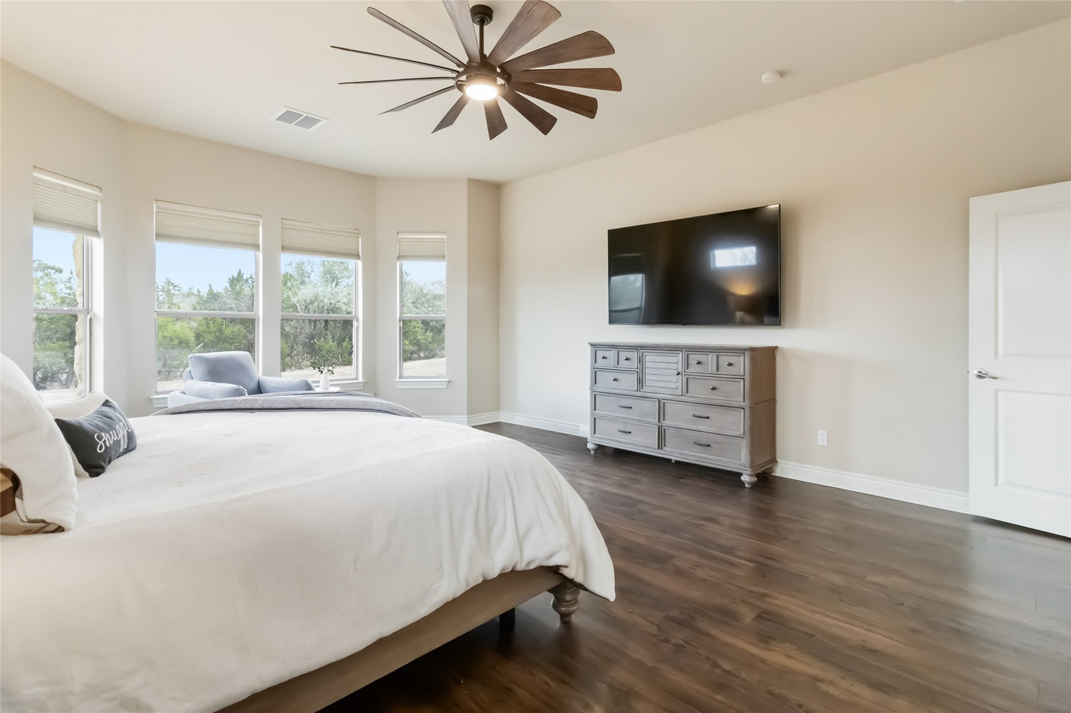 108 Standing Oak Drive Georgetown, TX 78633 - Photo 22 of 37 Large windows overlook the backyard, bringing in natural light and a peaceful view while enhancing the open feel of the primary suite. The layout offers flexibility for a sitting area or reading nook, making this space both relaxing and versatile.