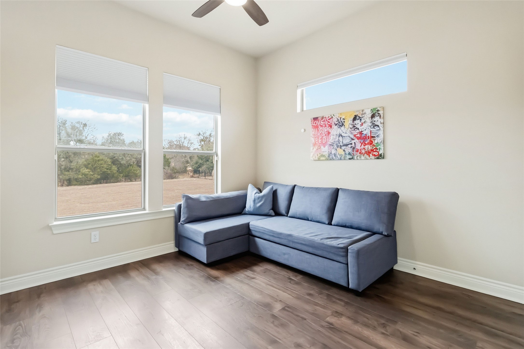 108 Standing Oak Drive Georgetown, TX 78633 - Photo 29 of 37 Bright and versatile third bedroom featuring large windows, ample wall space, and a functional layout that easily adapts as a bedroom, playroom, or hobby space.