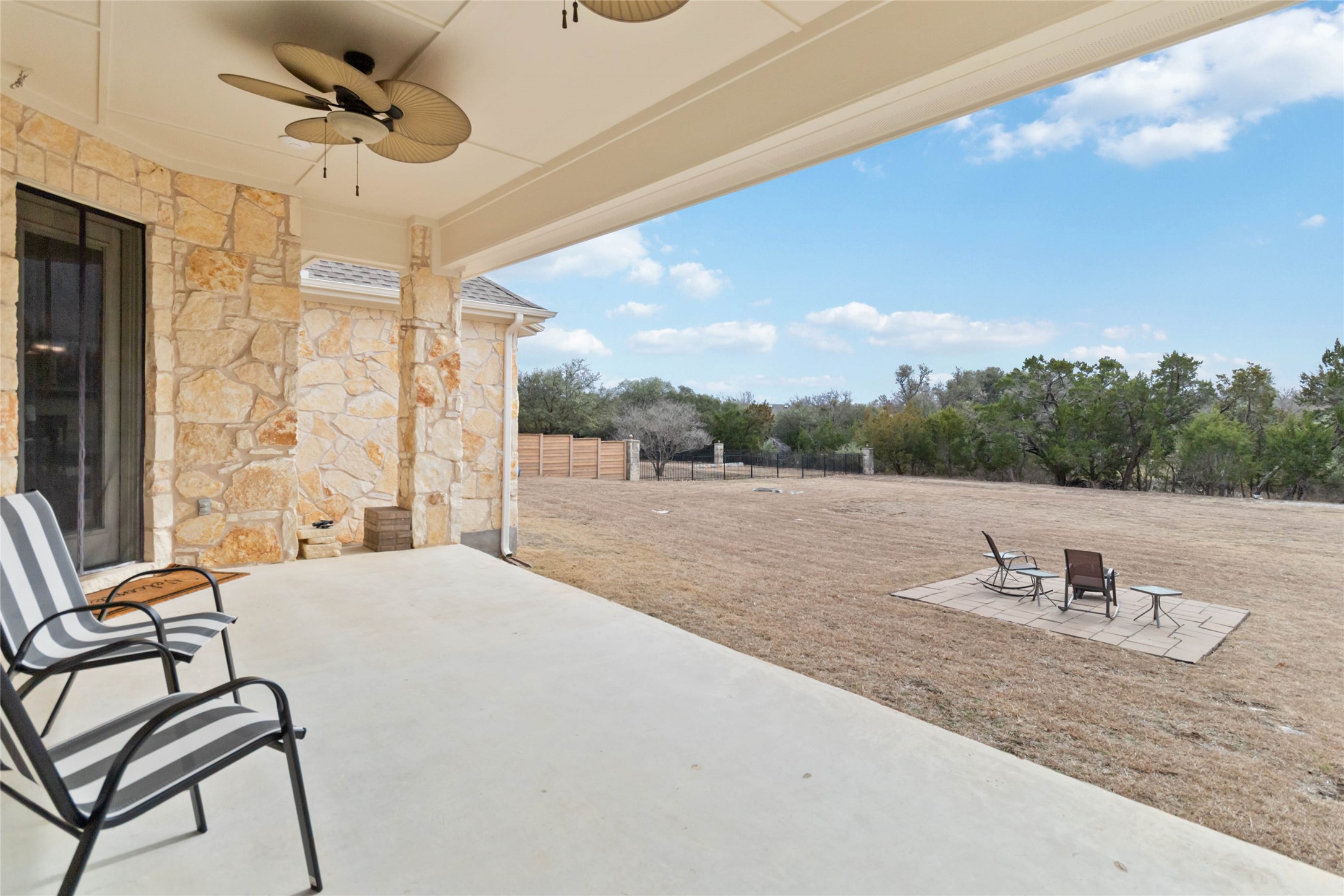 108 Standing Oak Drive Georgetown, TX 78633 - Photo 33 of 37 Extended covered back porch opens to a large, level backyard with wide-open views, offering plenty of space for future outdoor living or a pool.
