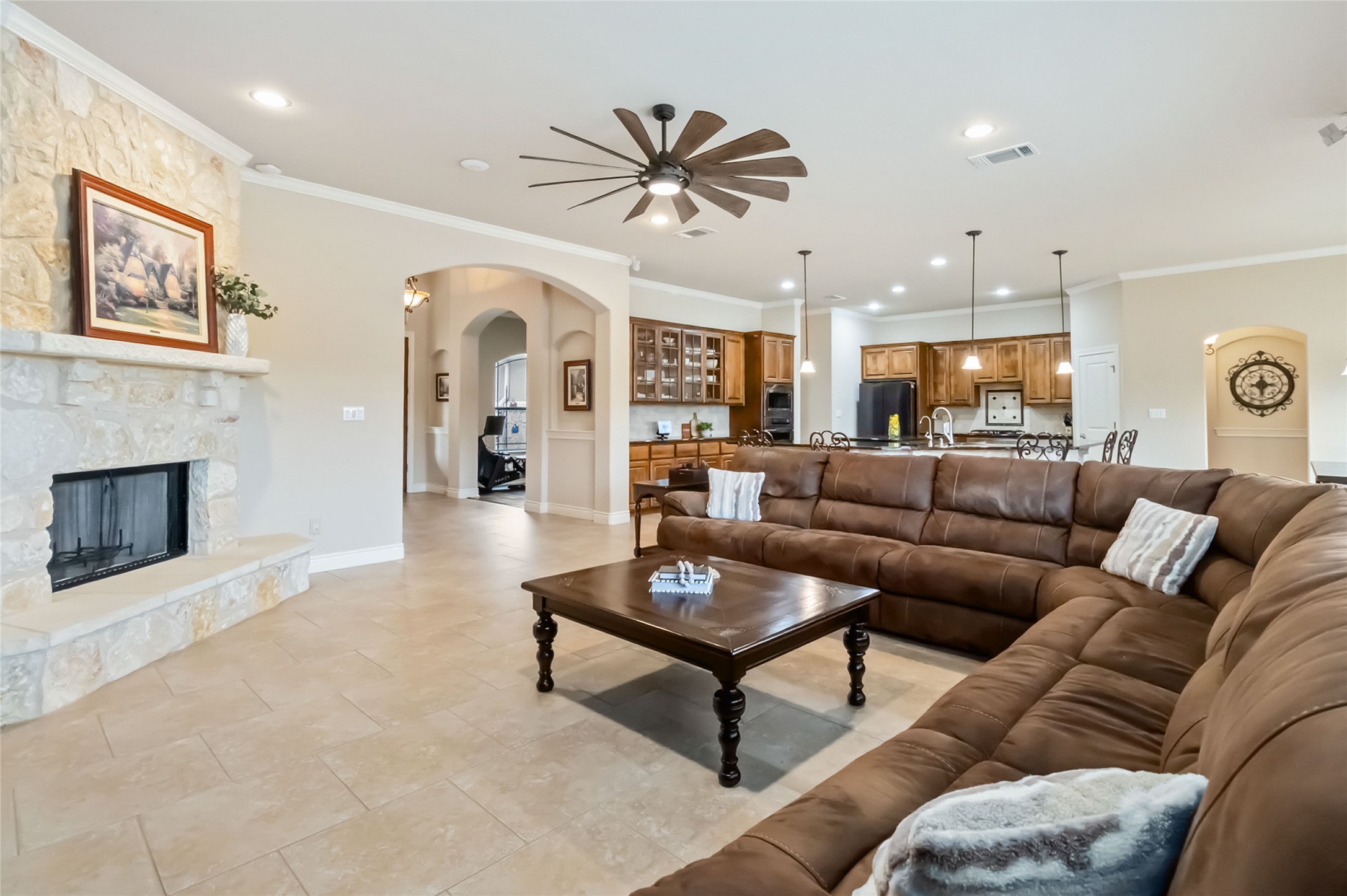 108 Standing Oak Drive Georgetown, TX 78633 - Photo 8 of 37 A second angle highlights the open-concept layout, connecting the living room seamlessly to the kitchen and dining areas, ideal for entertaining and everyday living.
