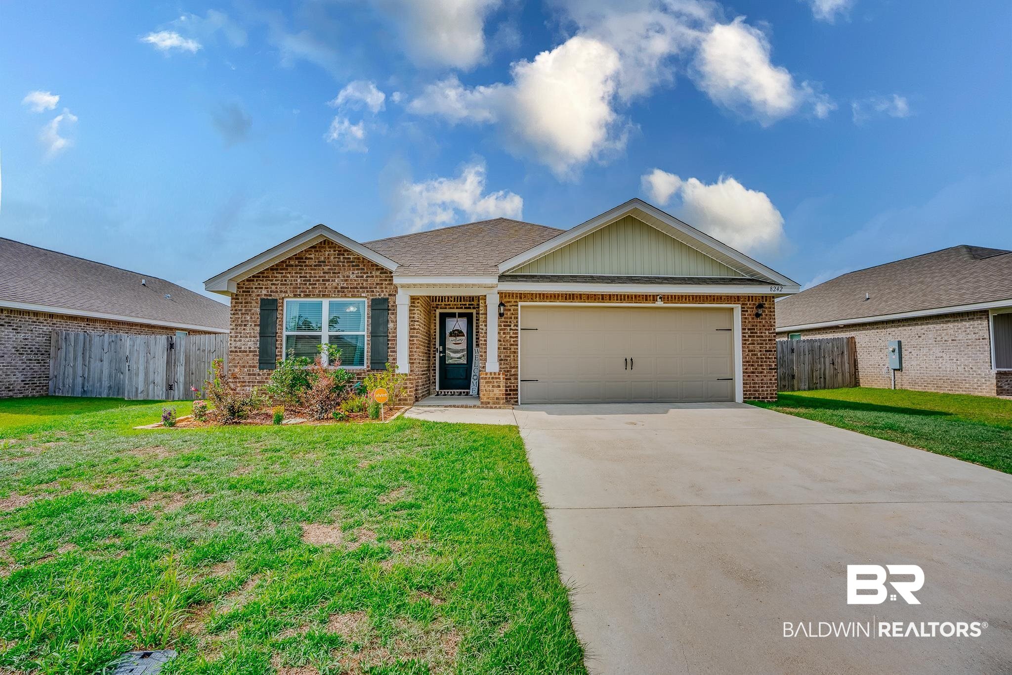 8242 Sycamore Way Semmes, AL 36575 - Photo 1 of 43 View of front of property with brick siding, driveway, and a garage