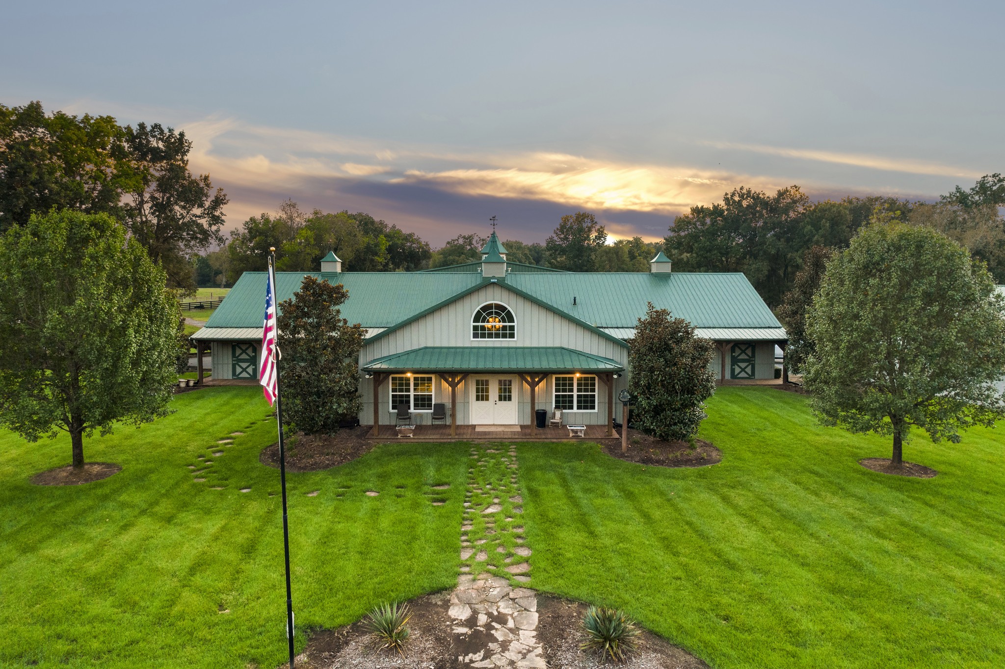 4760 Sharpsville Road Murfreesboro, TN 37130 - Photo 40 of 50 a view of a big house with a big yard and potted plants and large trees