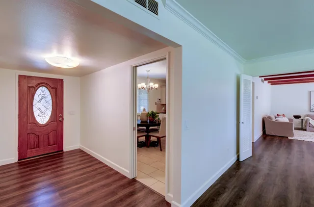 a view of an entryway with wooden floor