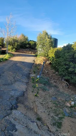 a view of a lake with beach and city view