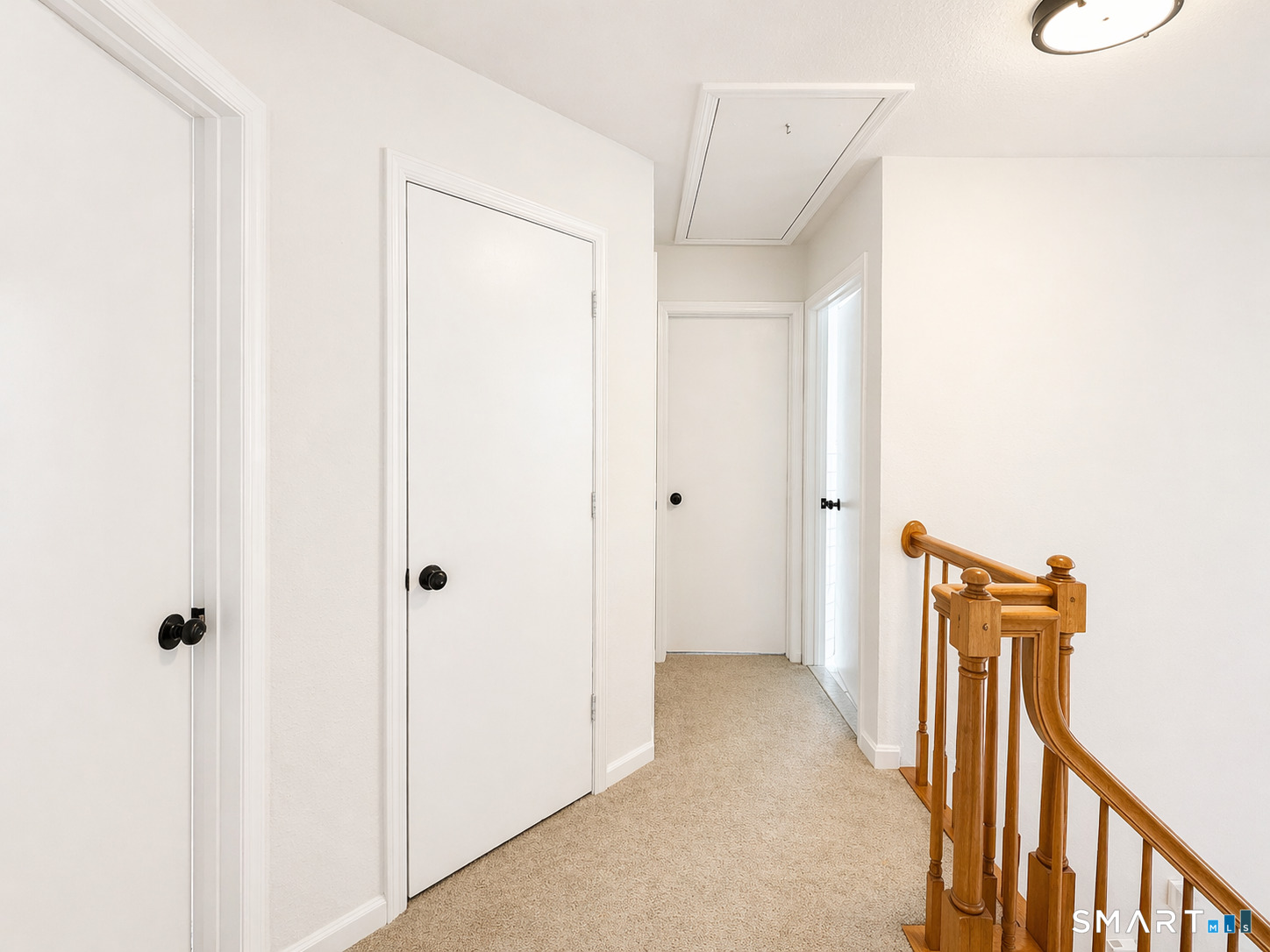 905 Oronoke Road, Unit 13 Waterbury, CT 06708 - Photo 14 of 18 a view of a hallway with wooden floor