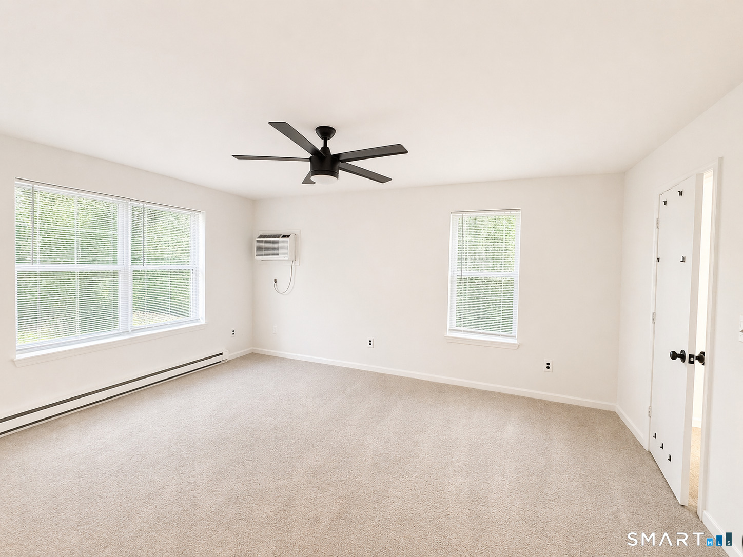 905 Oronoke Road, Unit 13 Waterbury, CT 06708 - Photo 17 of 18 wooden floor in an empty room with a window