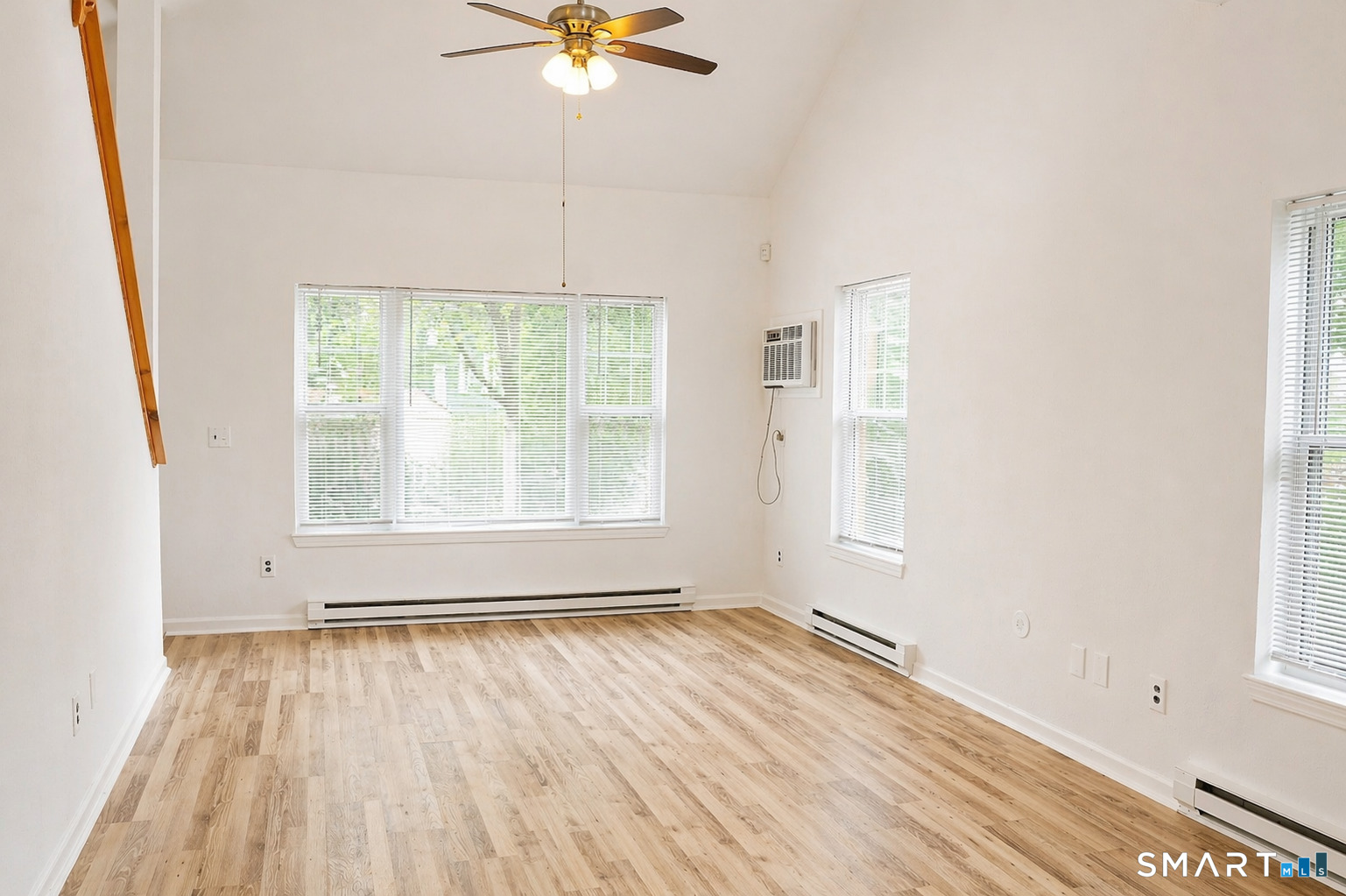 905 Oronoke Road, Unit 13 Waterbury, CT 06708 - Photo 5 of 18 wooden floor in an empty room with a window
