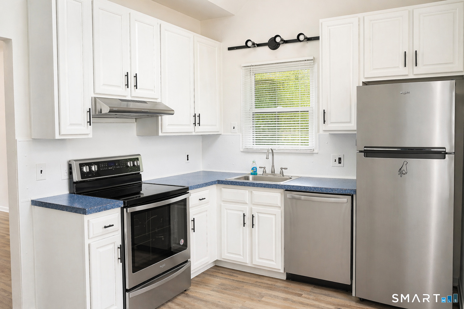 905 Oronoke Road, Unit 13 Waterbury, CT 06708 - Photo 6 of 18 a kitchen with granite countertop white cabinets white stainless steel appliances and sink