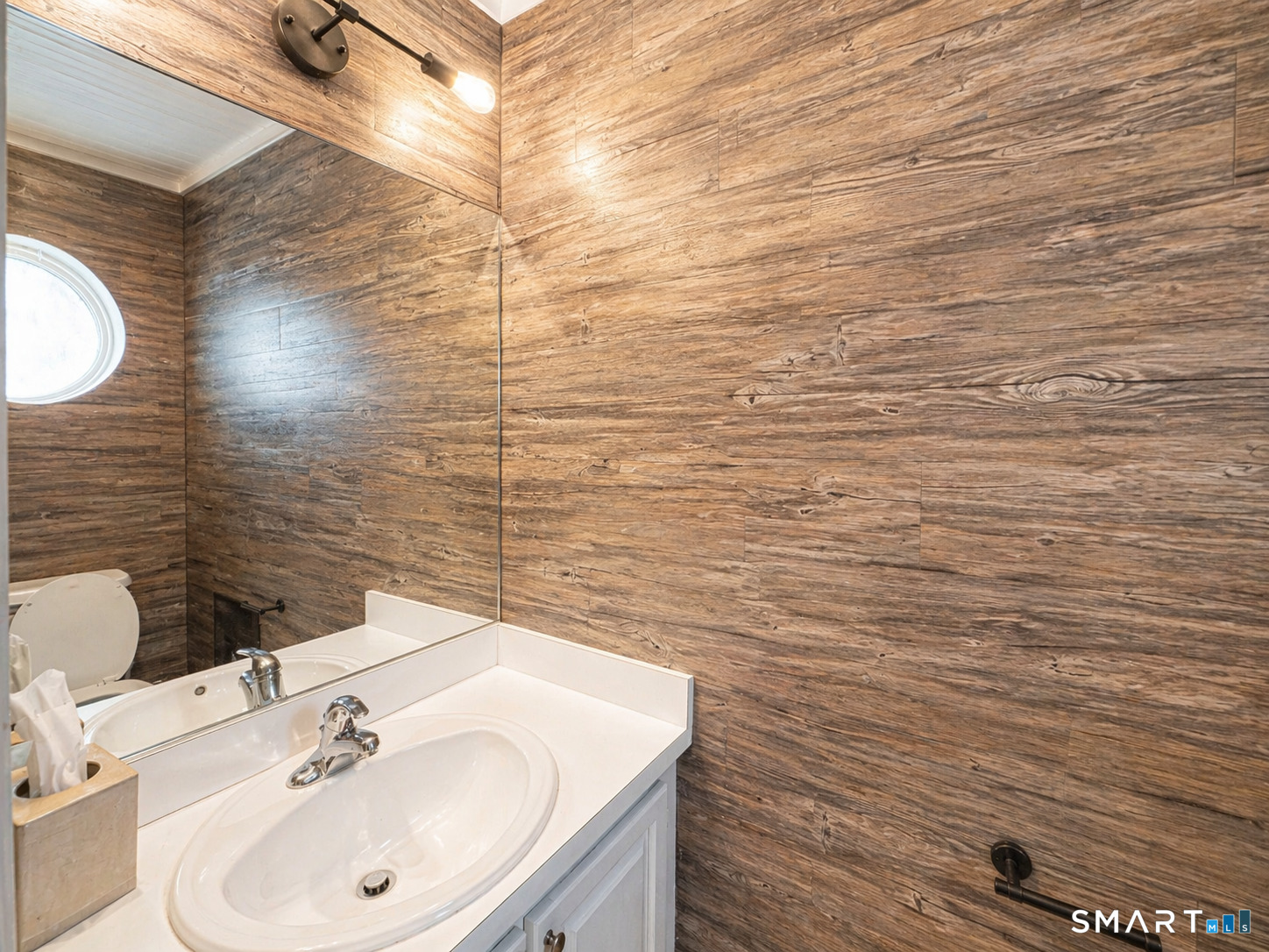 905 Oronoke Road, Unit 13 Waterbury, CT 06708 - Photo 9 of 18 a bathroom with a sink and a mirror