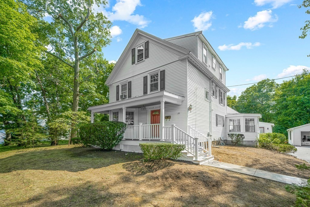 20 Donizetti Street Wellesley, MA 02482 - Photo 1 of 1 a view of a white house next to a yard with big trees